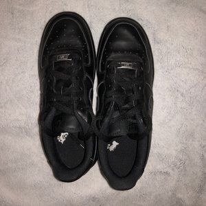 Black Nike Air Force One shoes